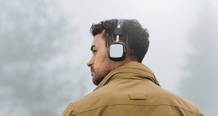 Guy with a bluetooth headphone