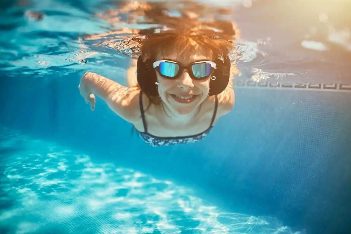 Woman swimming with headphones