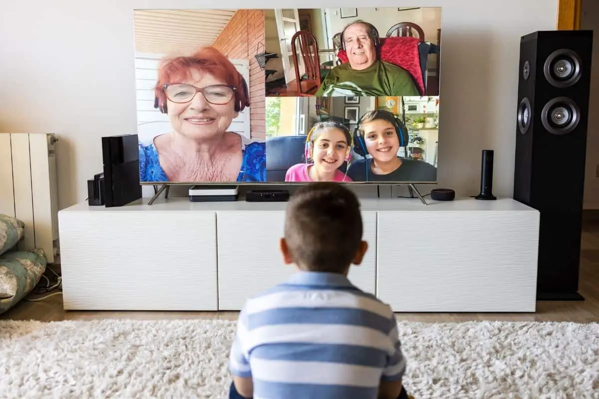 Kid talking to family on TV via video chat