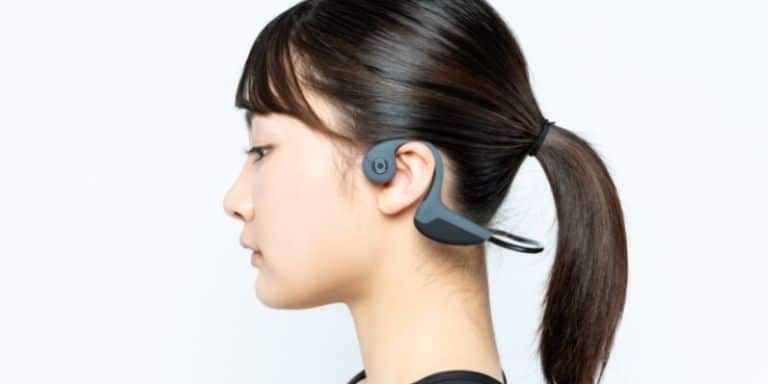 Woman wearing bone conduction headphones