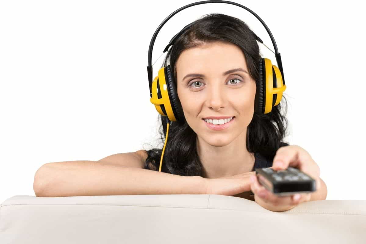 Woman watching TV with headphones