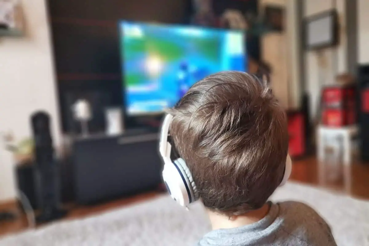 Boy watching TV with headphones
